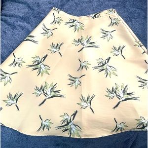 Forever21 contemporary fit and flare skirt. Canary yellow with a plant print.